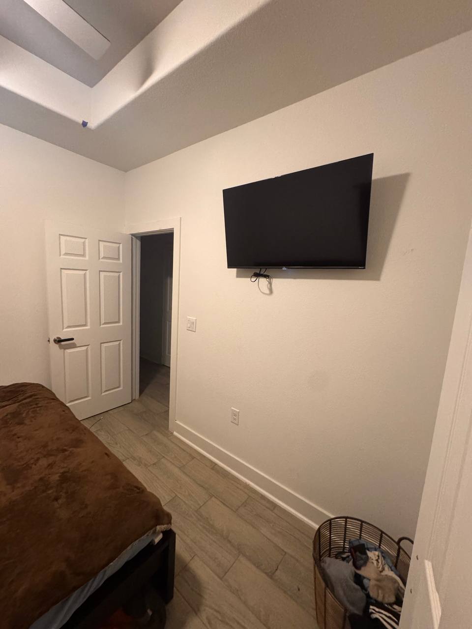 Bedroom with mounted TV